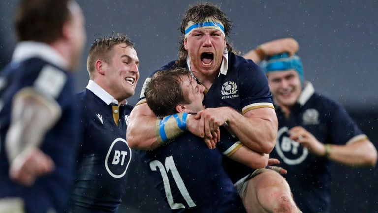 Hamish Watson (centre) celebrates with his Scotland team-mates after defeating England 6-11 at Twickenham (AP)