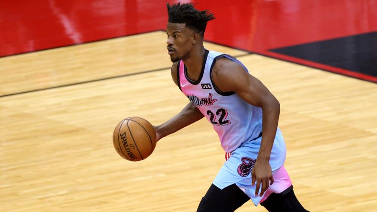 Miami Heat&#39;s Jimmy Butler brings the ball up during the first quarter against the Houston Rockets
