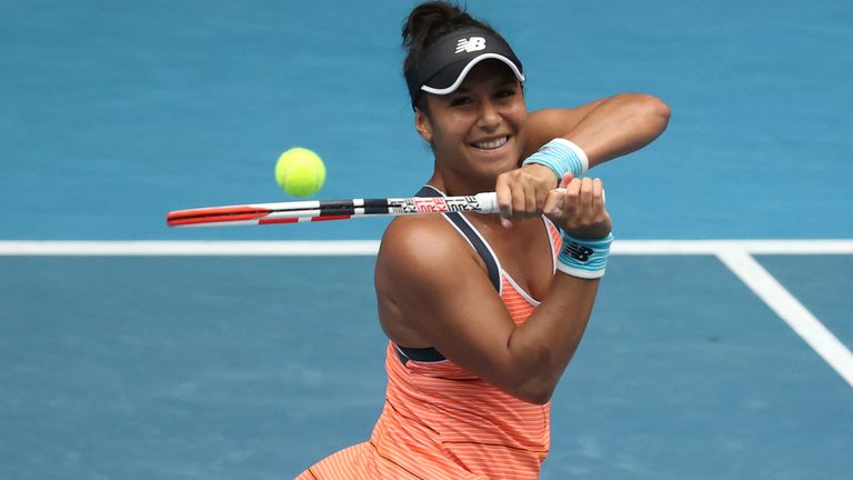 Britain's Heather Watson makes a backhand return to Estonia's Anett Kontaveit during their second round match at the Australian Open tennis championship in Melbourne, Australia, Thursday, Feb. 11, 2021.(AP Photo/Hamish Blair)