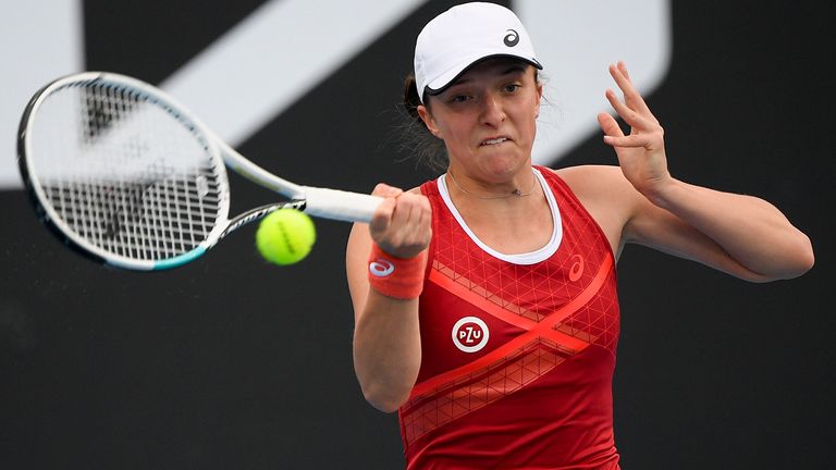 Poland's Iga Swiatek makes a forehand return to Slovenia's Kaja Juvan during a tuneup tournament ahead of the Australian Open tennis championships in Melbourne, Australia, Tuesday, Feb. 2, 2021. (AP Photo/Andrew Brownbill)