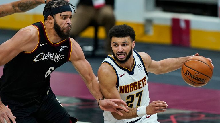 Denver Nuggets&#39; Jamal Murray drives past Cleveland Cavaliers&#39; JaVale McGee