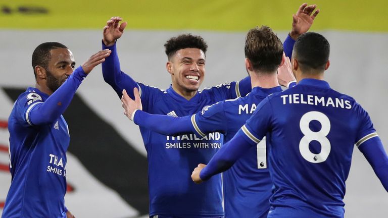James Justin celebrates with team-mates after doubling Leicester's lead (AP)