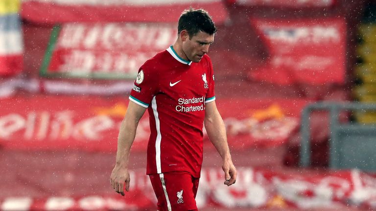 James Milner shows his dejection as he leaves the pitch