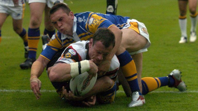 Pix by BEN DUFFY/SWpix.com - Rugby League Super League - Leeds Rhinos v Bradford Bulls...01/07/05..Picture Copyright >> Simon Wilkinson >> 07811267706..Leed's Kevin Sinfield cannot stop Bradford's Jamie Peacock from going over to score a try