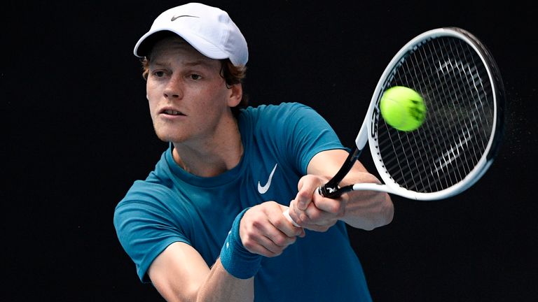 Italy's Jannik Sinner hits a backhand to Russia's Karen Khachanov during a tuneup event ahead of the Australian Open tennis championships in Melbourne, Australia, Saturday, Feb. 6, 2021. (AP Photo/Andy Brownbill)