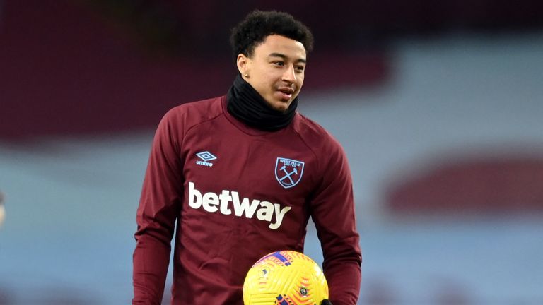 Jesse Lingard warms up at Villa Park