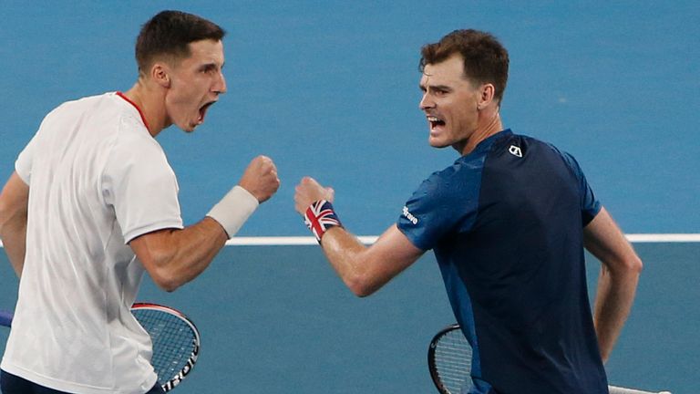 Jamie Murray and Joe Salisbury of Britain react after winning a point in the game between Sander Gille and Joran Vliegen of Belgium and Jamie Murray and Joe Salisbury of Britain during their ATP Cup tennis doubles match in Sydney, Sunday, Jan. 5, 2020. (AP Photo/Steve Christo)
