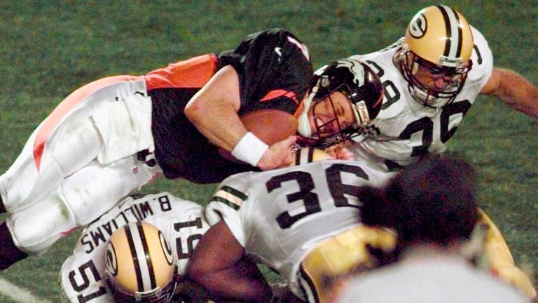 John Elway dives for the first-down marker in his famous 'helicopter run' in Denver's Super Bowl XXXII win over Green Bay