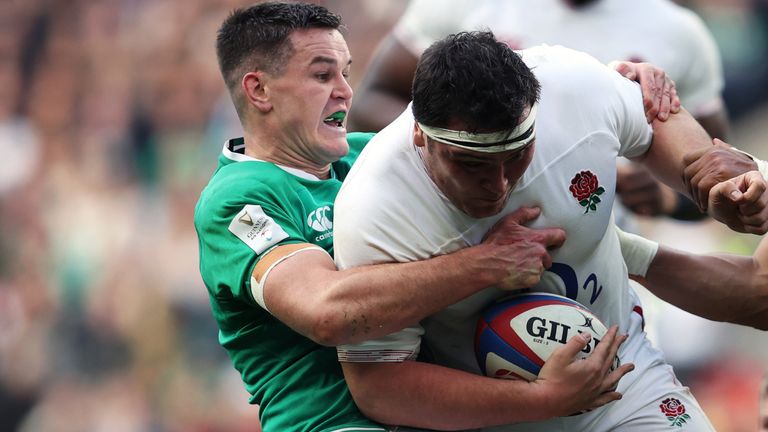 Ireland captain Johnny Sexton tackles England's Jamie George during the 2020 Six Nations (PA image)