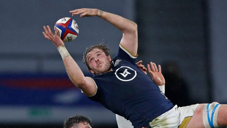 Scotland's Jonny Gray gathers the ball during the Six Nations rugby union international between England and Scotland at Twickenham stadium in London, Saturday, Feb. 6, 2021. (AP Photo/Alastair Grant)..