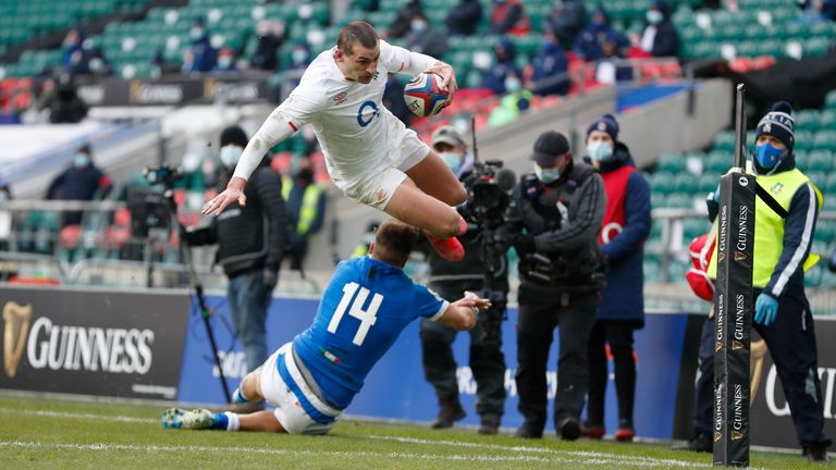 England's Jonny May scores a try during the Six Nations rugby union international match between England and Italy at Twickenham Stadium in London, Saturday, Feb. 13, 2021. (AP Photo/Alastair Grant)