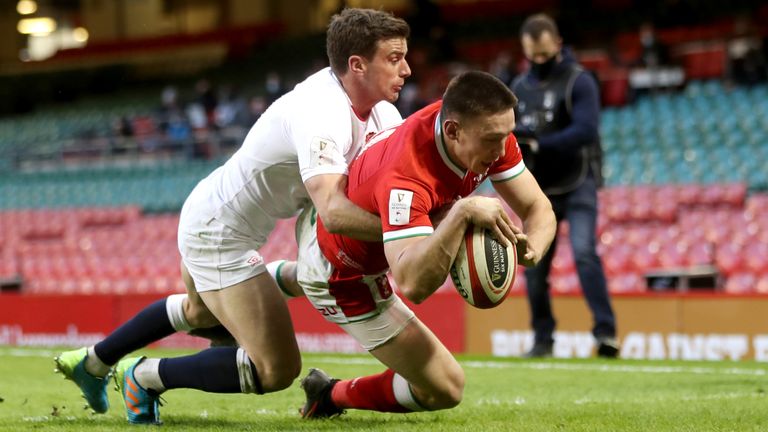 Wales' Josh Adams dives in to score his sides first try during the Guinness Six Nations match at the Principality Stadium, Cardiff. Picture date: Saturday February 27, 2021. See PA story RUGBYU Wales. Photo credit should read: David Davies/PA Wire. RESTRICTIONS: Use subject to restrictions. Editorial use only, no commercial use without prior consent from rights holder.