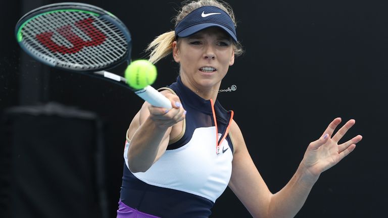 Britain's Katie Boulter makes a forehand return to Russia's Daria Kasatkina during their first round match at the Australian Open tennis championship in Melbourne, Australia, Monday, Feb. 8, 2021.(AP Photo/Hamish Blair)