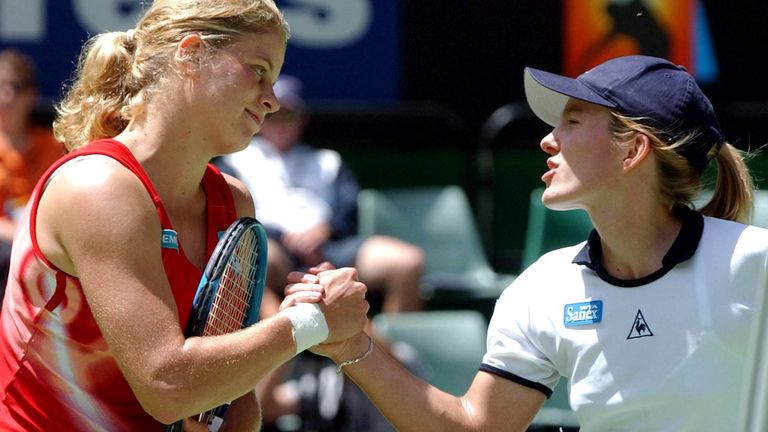 Kim Clijsters, of Belgium, left, shakes hands at the net with her compatriot, Justine Henin after her 6-2, 6-3, victory over Henin in their quarterfinal match at the Australian Open