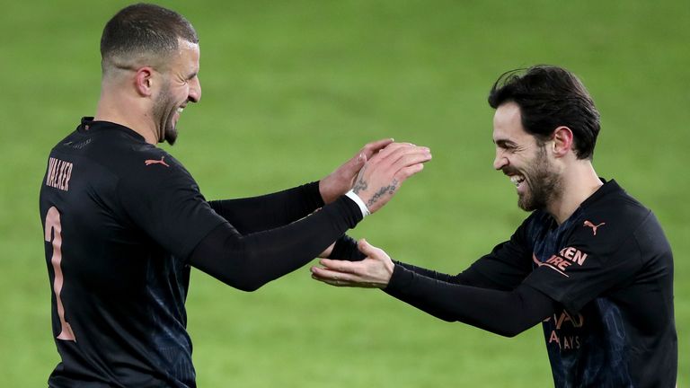 Kyle Walker celebrates scoring Manchester City's opening goal against Swansea with Bernardo Silva