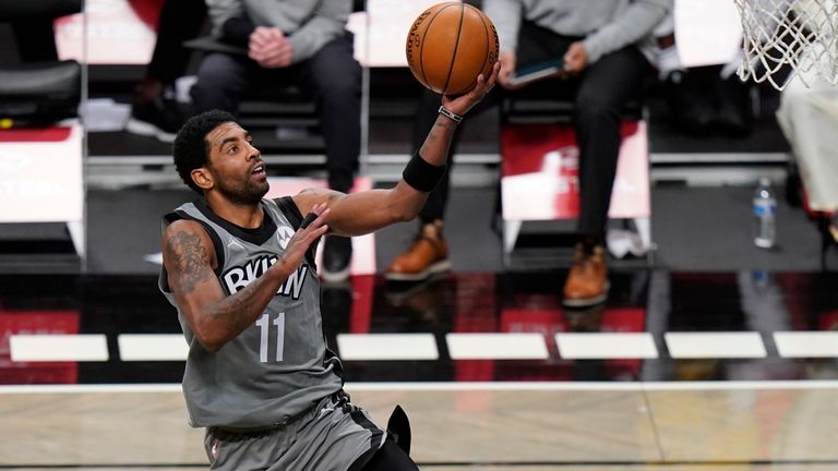 Brooklyn Nets&#39; Kyrie Irving drives to the basket