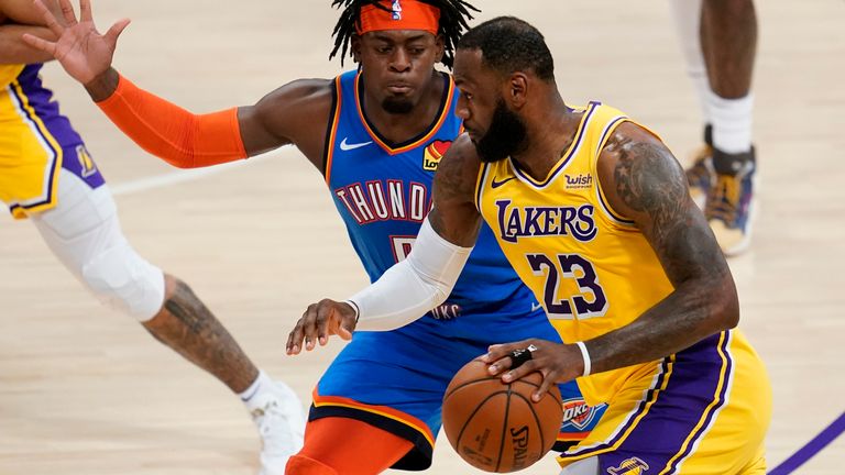 Oklahoma City Thunder forward Luguentz Dort defends against Los Angeles Lakers forward LeBron James