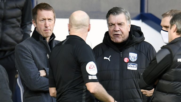 Referee Lee Mason speaks to both managers following confusion over Brighton's disallowed goal