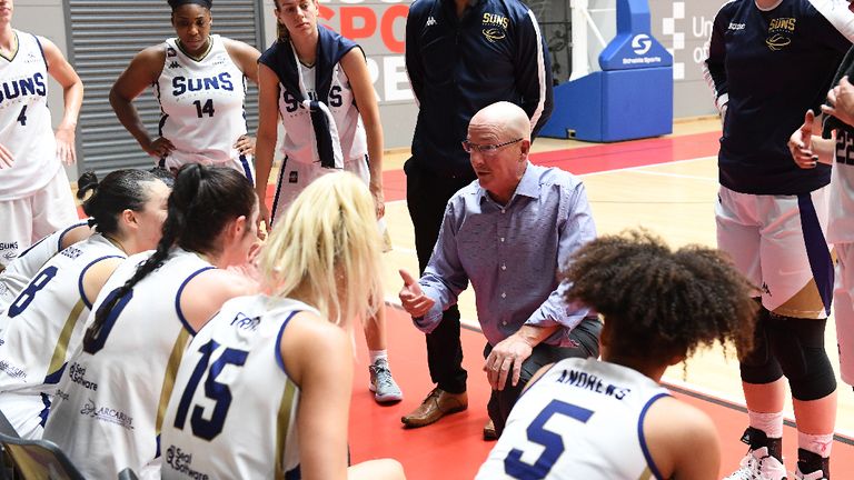 Suns head coach Len Busch gives his players some instructions
