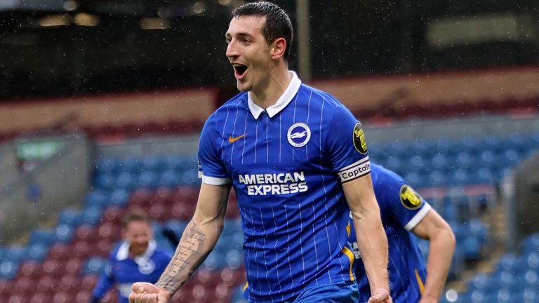 Lewis Dunk celebrates his first-half goal (AP)