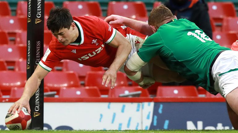 Louis Rees-Zammit crosses in the corner for Wales' second try