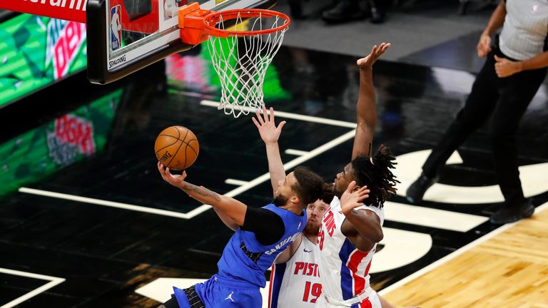 Orlando Magic guard Michael Carter-Williams gots to the basket as Detroit Pistons guard Svi Mykhailiuk and Detroit Pistons center Isaiah Stewart