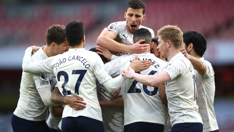 Man City players celebrate as they made it 18 straight wins