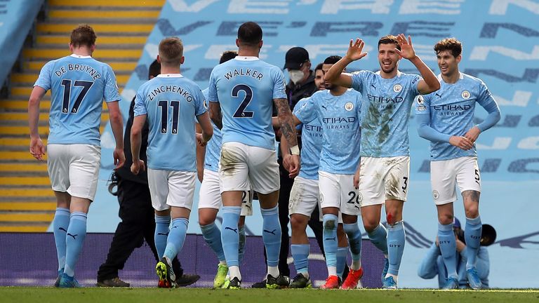 Ruben Dias celebrates with team-mates during City's 2-1 win over West Ham