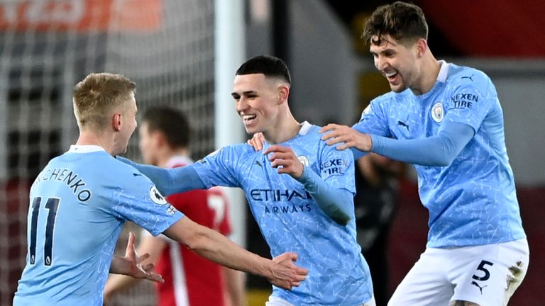 Phil Foden celebrates with Man City team-mates