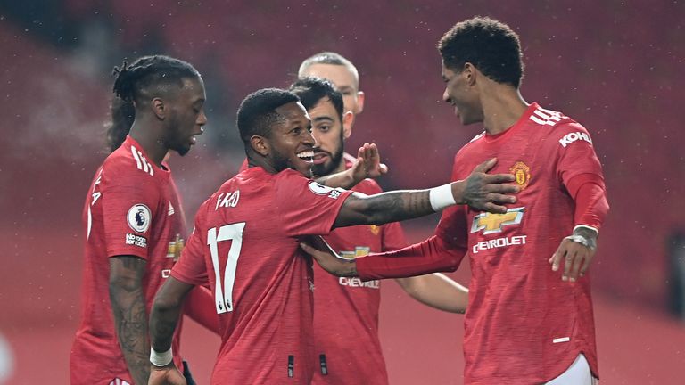 Manchester United's Fred and Marcus Rashford celebrate after their third goal is scored against Southampton