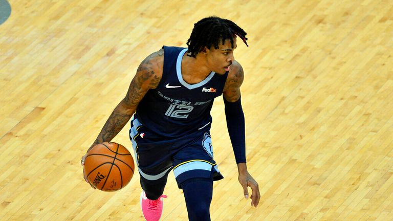 AP - Memphis Grizzlies guard Ja Morant handles the ball