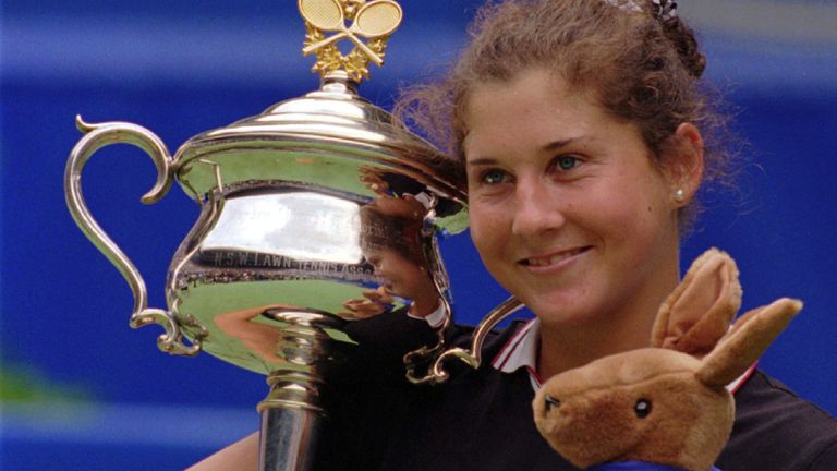 Monica Seles holds the trophy and a toy Kangaroo after winning the women's final at the Australian Open tennis tournament in Melbourne, in this Jan. 27, 1996 file photo