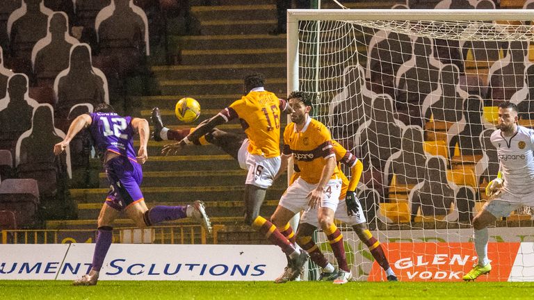 Ryan Edwards pulls a goal back for Dundee United with a strong header