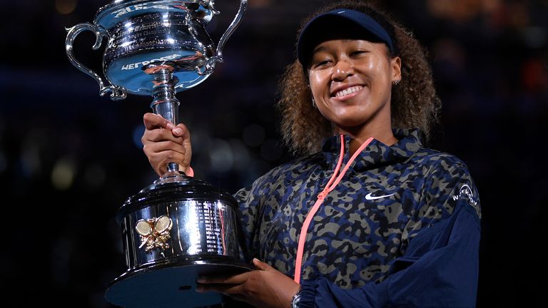Naomi Osaka holds the Daphne Akhurst Memorial Cup aloft after winning the women's singles title last year