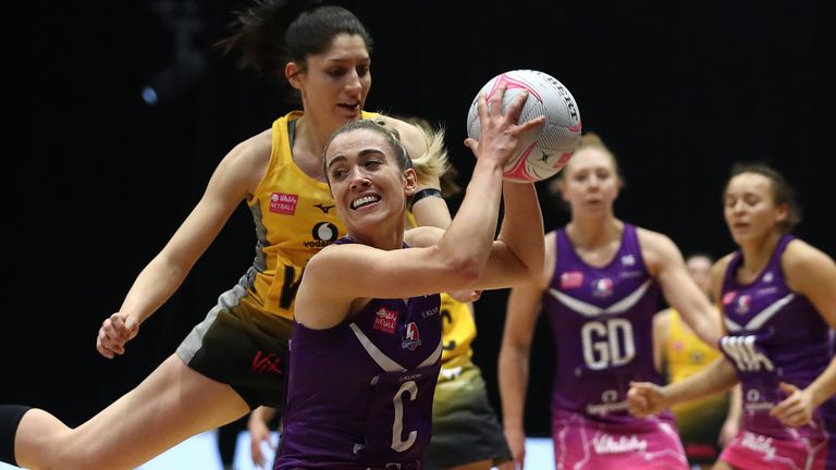 Natalie Panagarry of Loughborough Lightning holds off Amy Flanagan of Wasps Netball