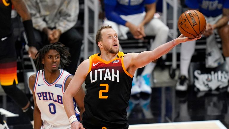 Utah Jazz forward Joe Ingles (2) lays the ball up as Philadelphia 76ers guard Tyrese Maxey (0) looks on in the second half during an NBA basketball game Monday, Feb. 15, 2021, in Salt Lake City. (AP Photo/Rick Bowmer)


