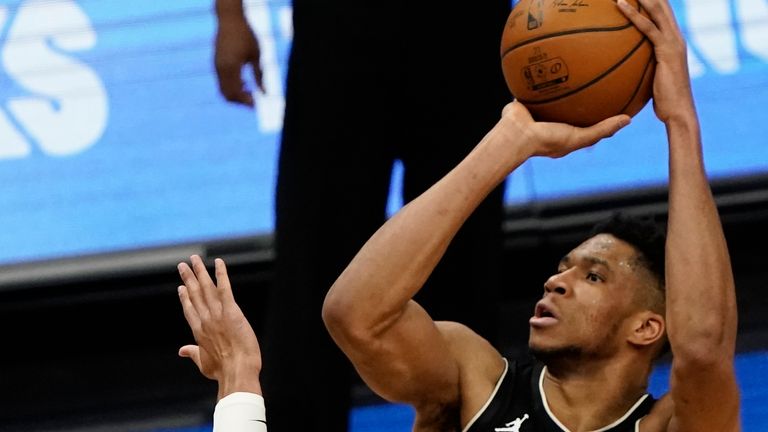 Milwaukee Bucks' Giannis Antetokounmpo shoots over New Orleans Pelicans' Josh Hart during the second half of an NBA basketball game Thursday, Feb. 25, 2021, in Milwaukee.