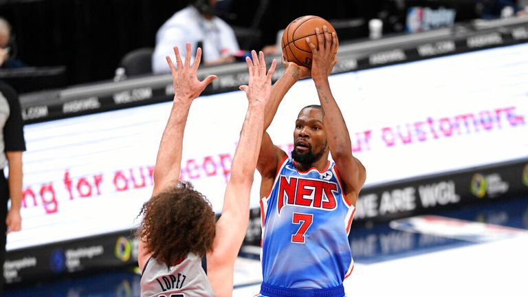 AP - Brooklyn Nets forward Kevin Durant (7) shoots against Washington Wizards center Robin Lopez (15) 
