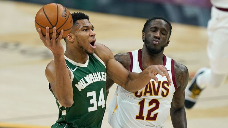 Milwaukee Bucks&#39; Giannis Antetokounmpo (34) drives to the basket against Cleveland Cavaliers&#39; Taurean Prince (12) in the first half of an NBA basketball game, Saturday, Feb. 6, 2021, in Cleveland. (AP Photo/Tony Dejak)



