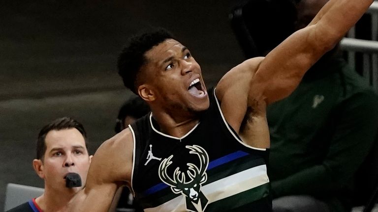 Milwaukee Bucks' Giannis Antetokounmpo shoots over New Orleans Pelicans' Josh Hart during the first half of an NBA basketball game Thursday, Feb. 25, 2021, in Milwaukee.