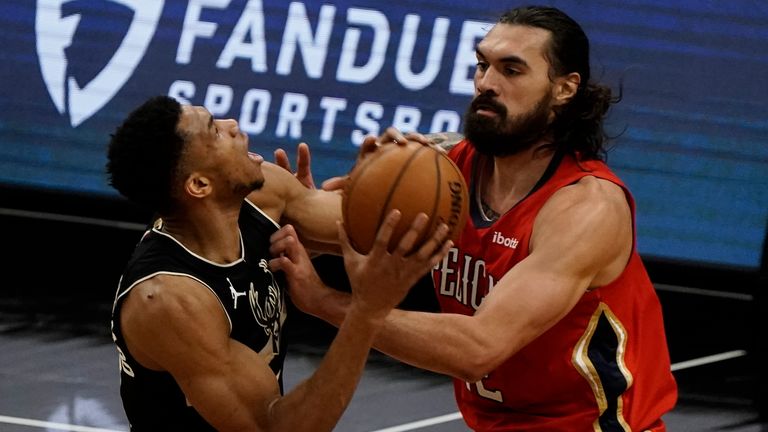 Milwaukee Bucks&#39; Giannis Antetokounmpo tries to drive past New Orleans Pelicans&#39; Steven Adams during the first half of an NBA basketball game Thursday, Feb. 25, 2021, in Milwaukee.