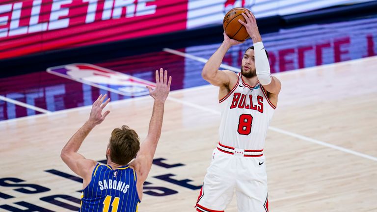 Chicago Bulls guard Zach LaVine (8) shoots over Indiana Pacers forward Domantas Sabonis (11) during the first half of an NBA basketball game in Indianapolis, Monday, Feb. 15, 2021. (AP Photo/Michael Conroy)


