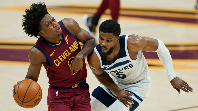 Cleveland Cavaliers&#39; Collin Sexton (2) collides with Minnesota Timberwolves&#39; Malik Beasley (5) in the first half of an NBA basketball game, Monday, Feb. 1, 2021, in Cleveland.