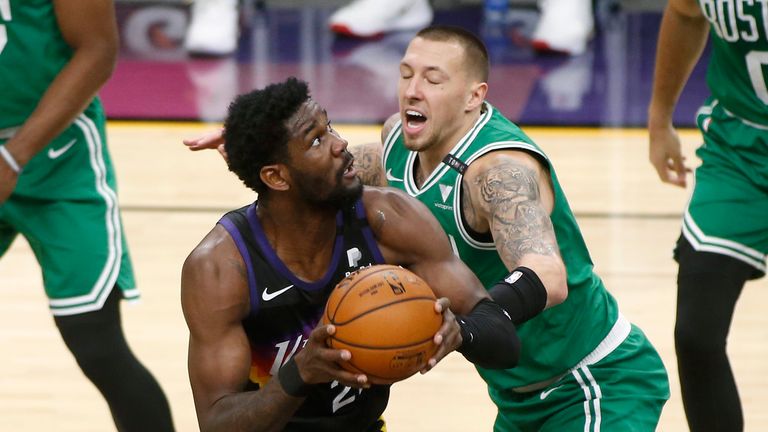 Phoenix Suns center Deandre Ayton, left, looks to shoot as Boston Celtics forward Daniel Theis defends during the first half of an NBA basketball game, Sunday, Feb. 7, 2021, in Phoenix. (AP Photo/Ralph Freso)


