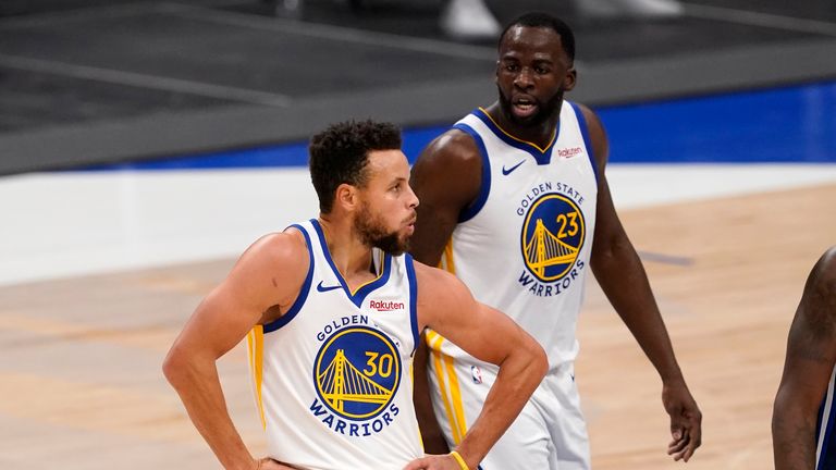 Golden State Warriors' Stephen Curry (30) celebrates with a dance move after sinking a three-point basket from near half court as Draymond Green (23) cheers him on in the second half of an NBA basketball game against the Dallas Mavericks in Dallas, Saturday, Feb. 6, 2021. (AP Photo/Tony Gutierrez)


