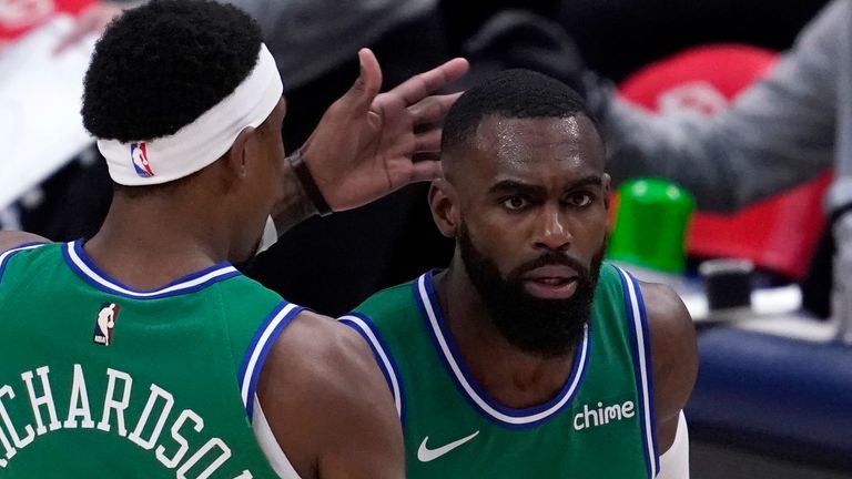 Dallas Mavericks' Josh Richardson (0) and Tim Hardaway Jr., right, celebrate a three-point basket scored by Hardaway in the first half of an NBA basketball game against the Memphis Grizzlies in Dallas, Monday, Feb. 22, 2021. 