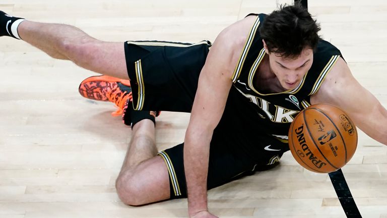 Atlanta Hawks forward Danilo Gallinari (8) falls to the floor after being fouled in the first half of an NBA basketball game against the Boston Celtics Wednesday, Feb. 24, 2021, in Atlanta. (AP Photo/John Bazemore)


