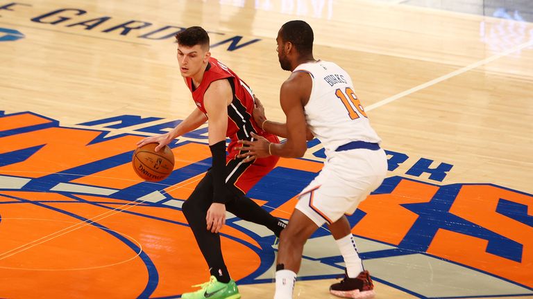 Alec Burks, right, of the New York Knicks defends against Tyler Herro, left, of the Miami Heat during an NBA basketball game on Sunday, Feb. 7, 2021, in New York City. (Mike Stobe/Pool Photo via AP)


