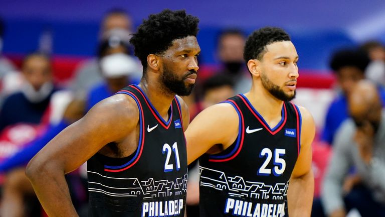 Philadelphia 76ers' Joel Embiid and Ben Simmons talk during an NBA basketball game against the Brooklyn Nets, Saturday, Feb. 6, 2021, in Philadelphia. (AP Photo/Matt Slocum)