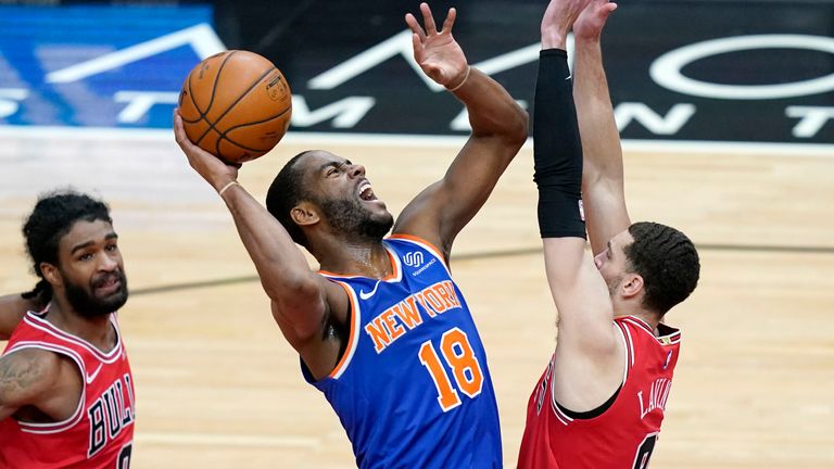 New York Knicks&#39; Alec Burks (18) shoots over Chicago Bulls&#39; Zach LaVine during the second half of an NBA basketball game Monday, Feb. 1, 2021, in Chicago.